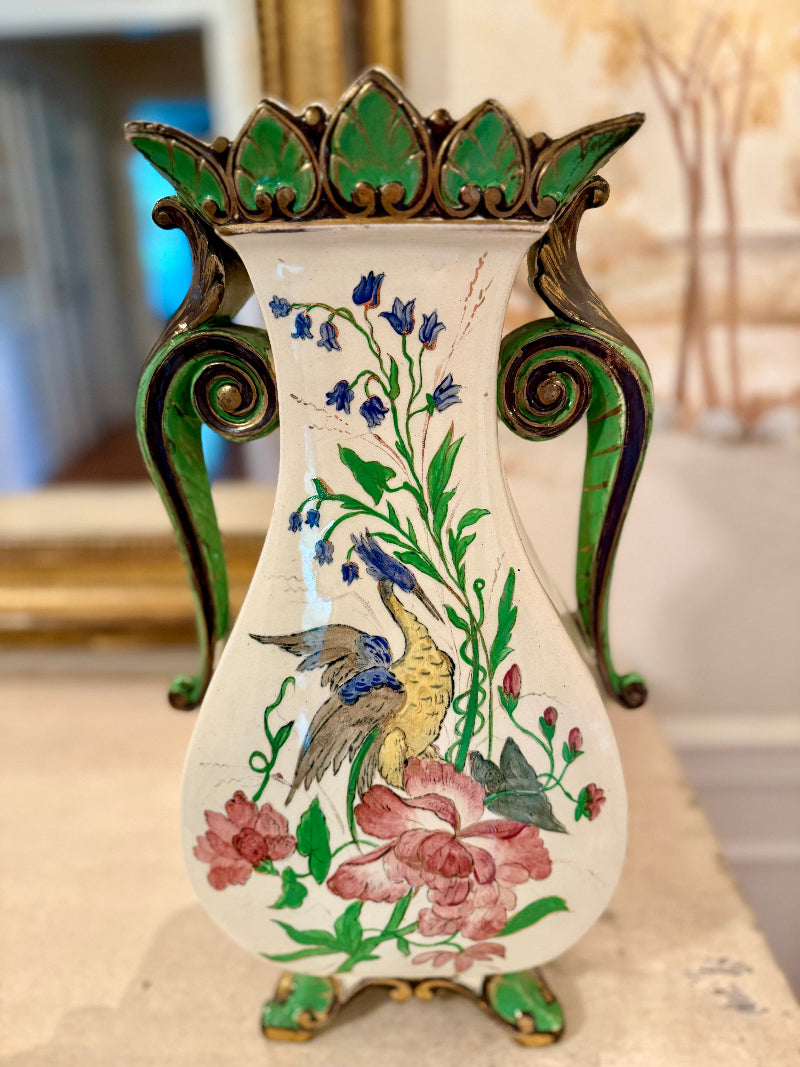 Antique French Art Nouveau vase with floral and bird design on a neutral background