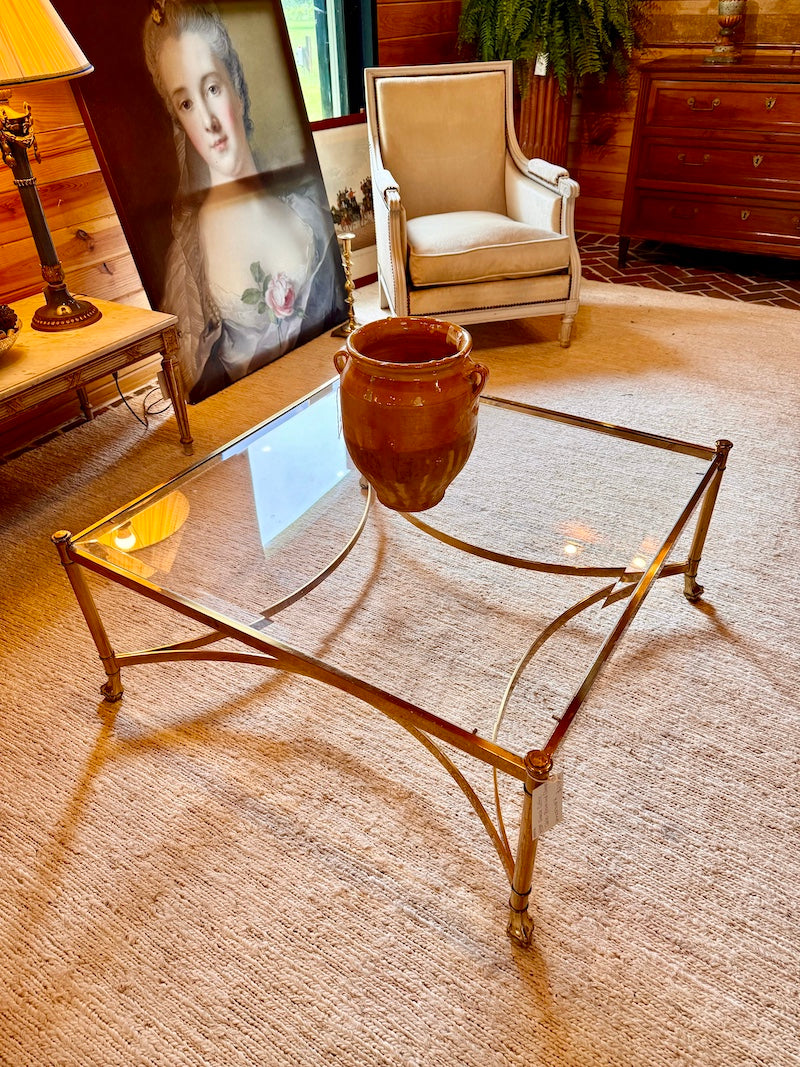 FRENCh 1950s brass and glass coffee table, armchair, and decorative items.