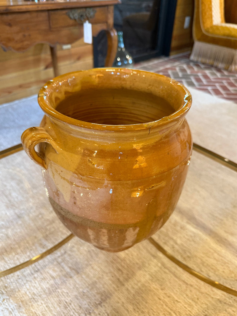 19th Century French ceramic vase on a wooden table