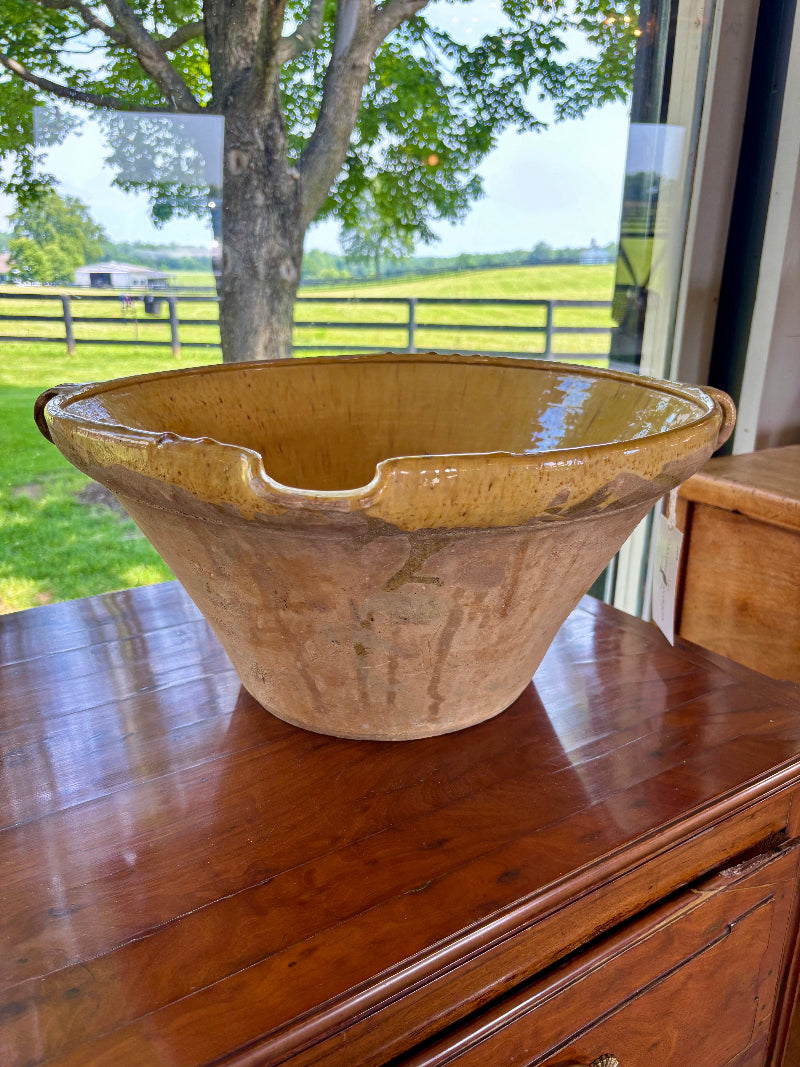 ANTIQUE French ceramic bowl on a wooden surface with a scenic background