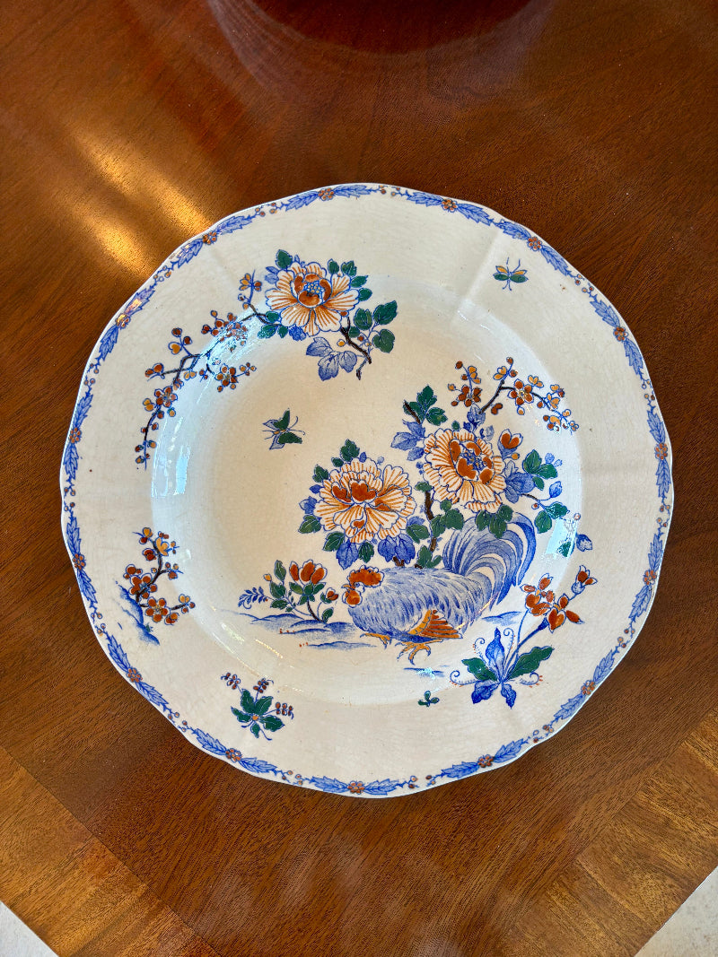 French Gien plate with floral patterns on a wooden surface