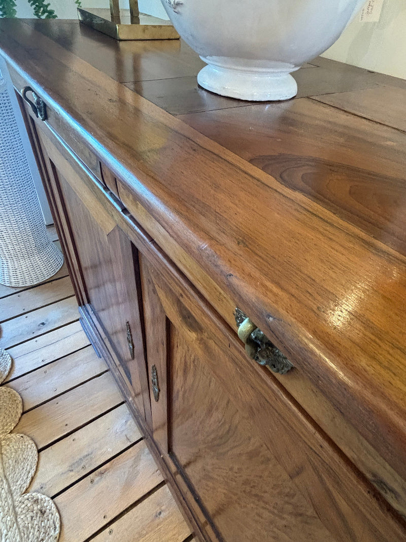Wooden cabinet with a lamp on a wooden floor