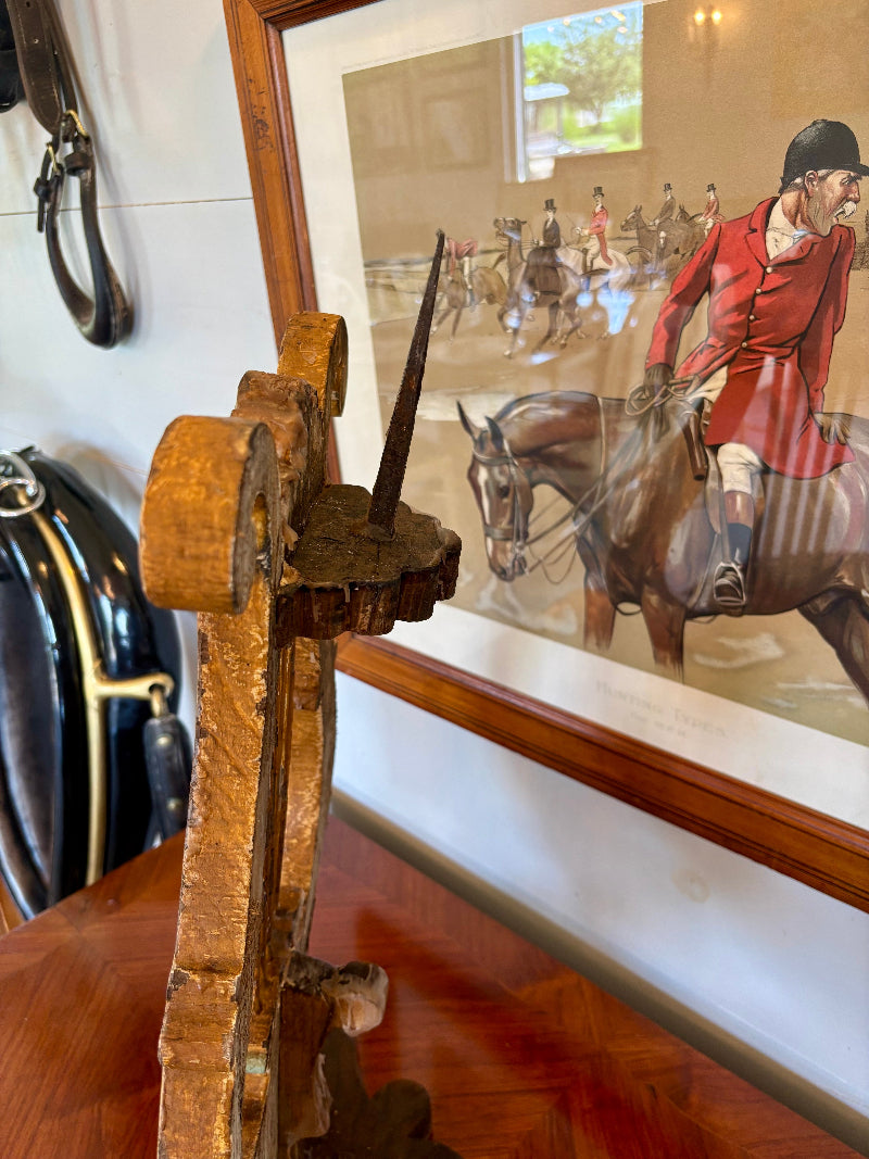 Wooden lyre-shaped candlestick with a place for pillar candle  with a painting of equestrian scene in the background