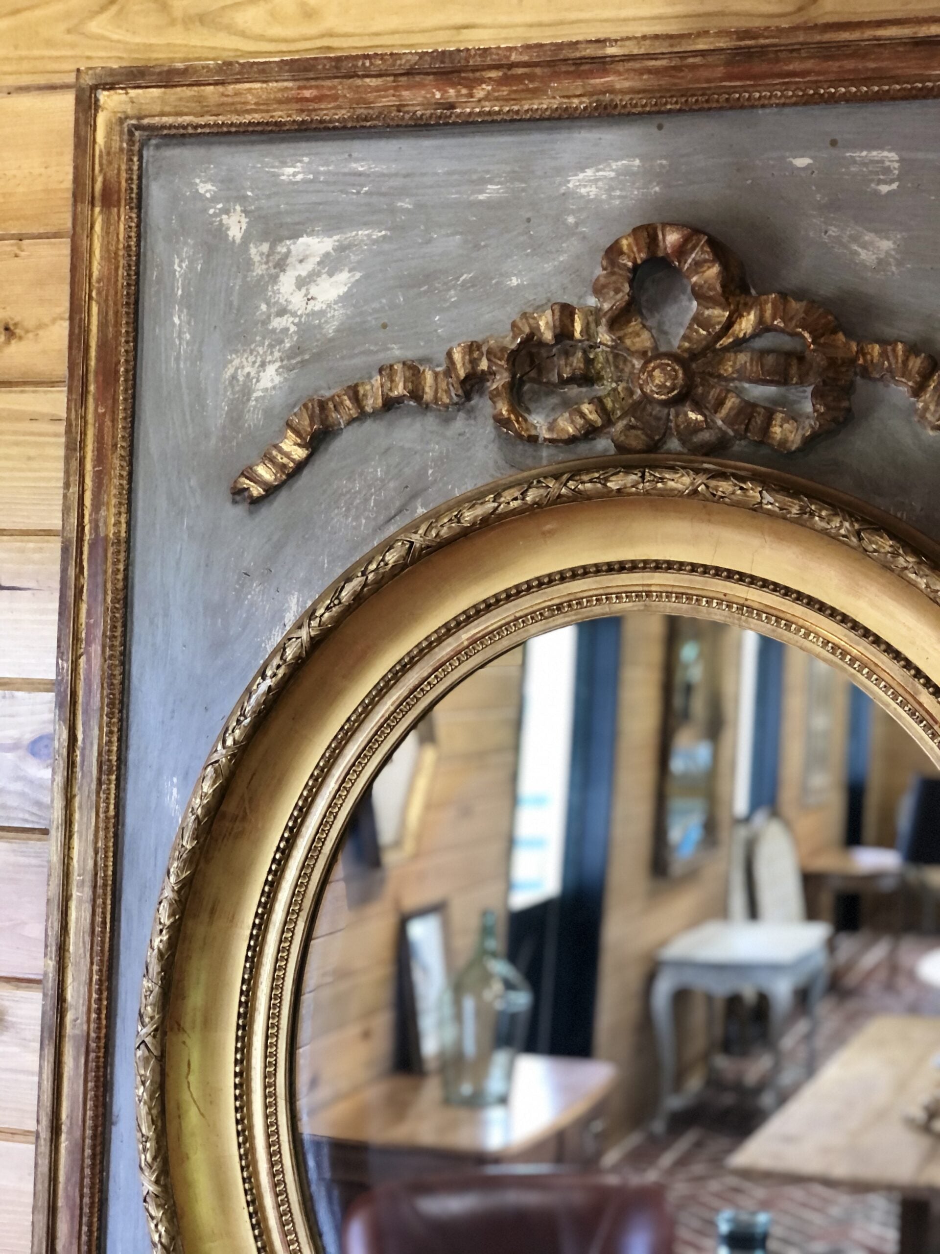 Gilded oval mirror in rectangular frame3